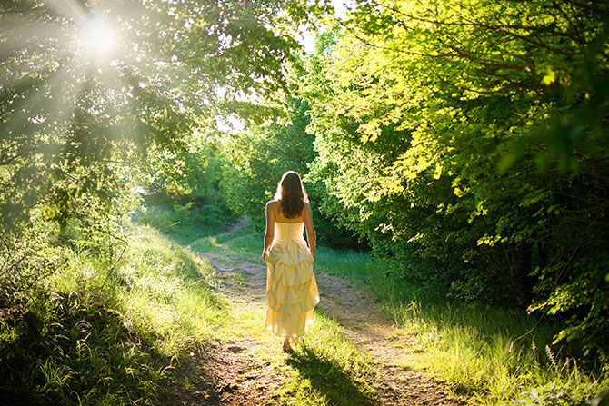 woman-walking-in-forest-compressor